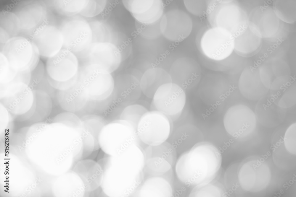 Obraz premium Defocused lights over silver background