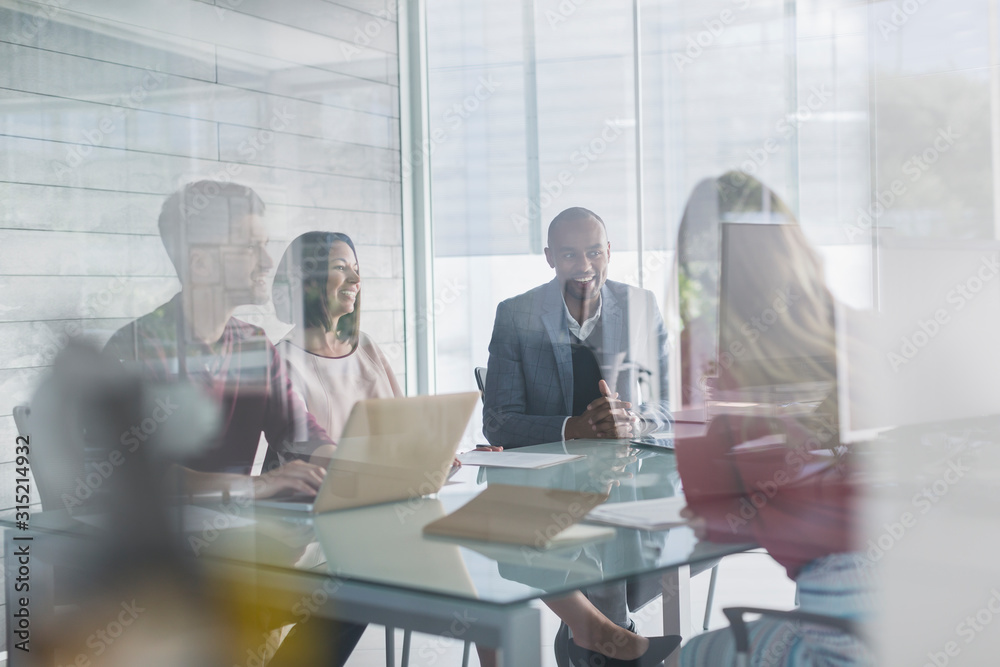 © Caiaimage/Martin Barraud/Caia Image - Business people talking, planning in conference room meeting
