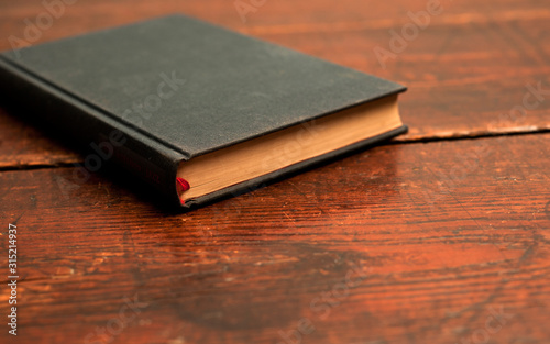 blue book on old wooden table