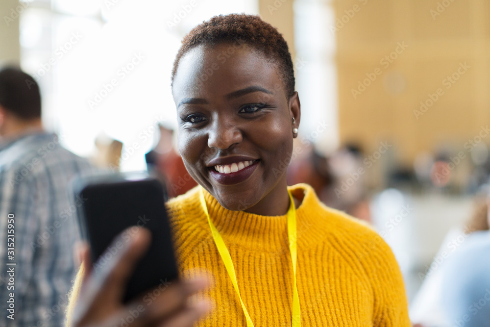 Smiling businesswoman using smart phone Smiling businesswoman using smart phone