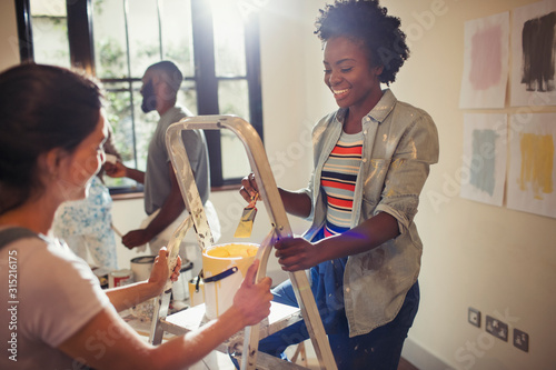 Women painting living room