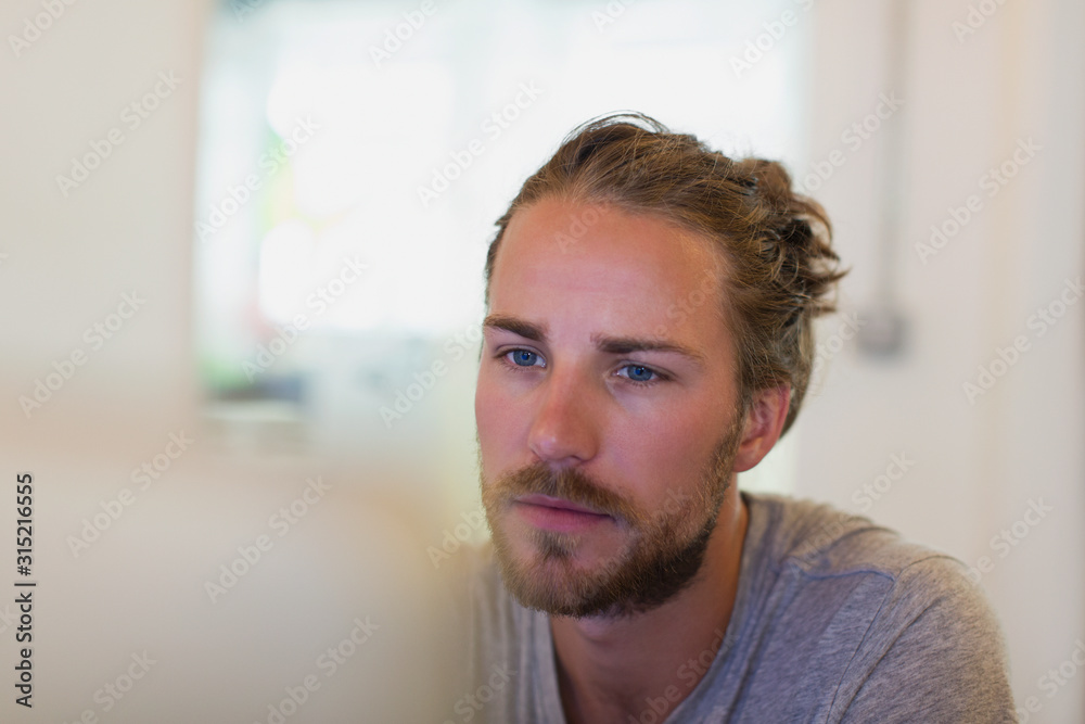 Focused creative businessman working at laptop Focused creative businessman working at laptop