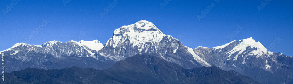 Beautiful and Amazing Snow-covered Mountain With Blue Sky - obrazy, fototapety, plakaty 
