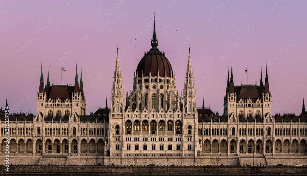 Close-up on the he Hungarian Parliament building in symmetry after sunset with beautiful sky.