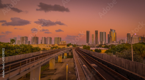city night circulation urban buildings view train lighting clouds architecture cityscape transportation sunset traveling sky miami florida