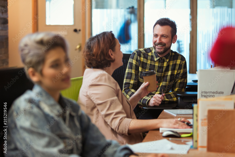 Creative business people meeting, talking in office
