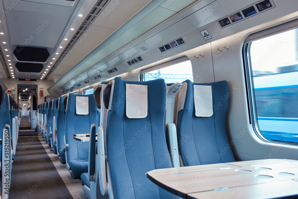Seats and table on empty passenger train Seats and table on empty passenger train