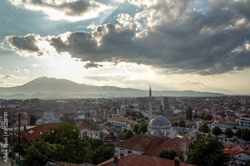 Panorama of the city center of Prizren, Kosovo, with minaret ofthe Sinan Pasha Mosque at sunset. Prizren is the second biggest city of Kosovo and a major ottoman architecture and cultural landmark photo