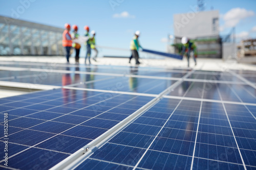 Solar panels at sunny power plant photo