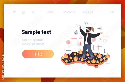 woman blogger in protective mask taking selfie photo on Australia map dangerous wildfire bushfire global warming natural disaster concept intense orange flames horizontal copy space vector