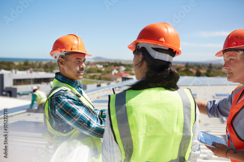 Workers talking at solar power plant