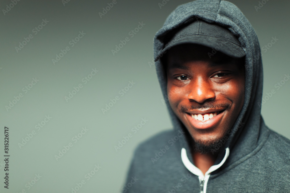 Portrait smiling, confident teenage boy in hoody Portrait smiling, confident teenage boy in hoody