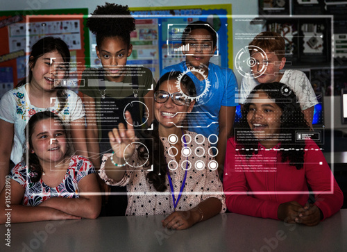 Teacher junior high school students using futuristic touch screen in classroom photo