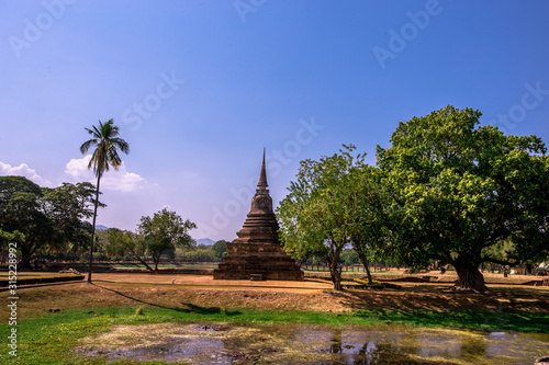 Background, the landmark of the Buddhist tourist attraction in Sukhothai Historical Park, tourists all over the world come to see the beauty always in Thailand. © bangprik