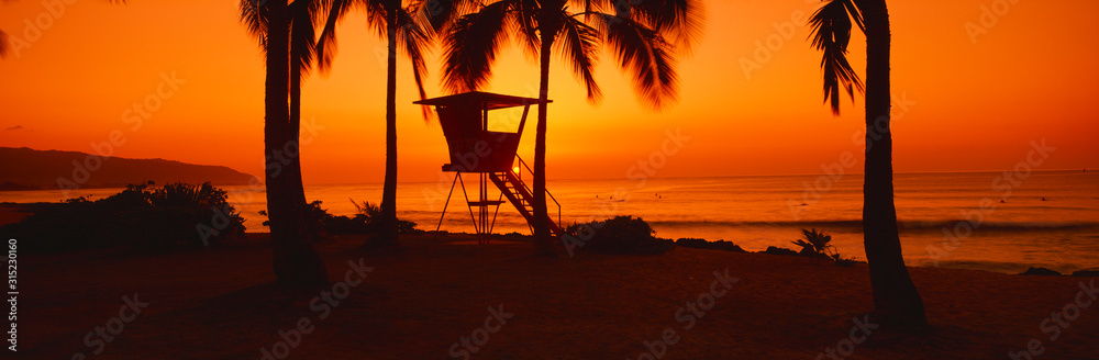 Sunset on lifeguard tower at Wailua Bay, North Shore, Oahu, Hawaii Sunset on lifeguard tower at Wailua Bay, North Shore, Oahu, Hawaii
