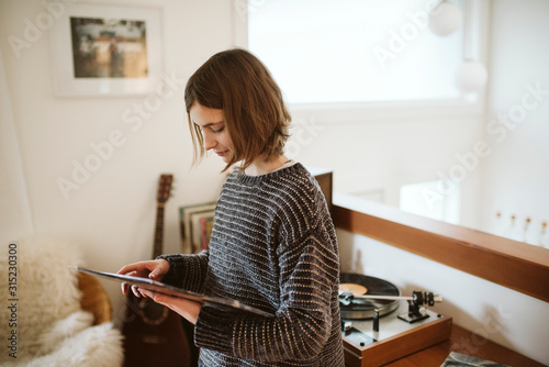 Girl playing vinyl records