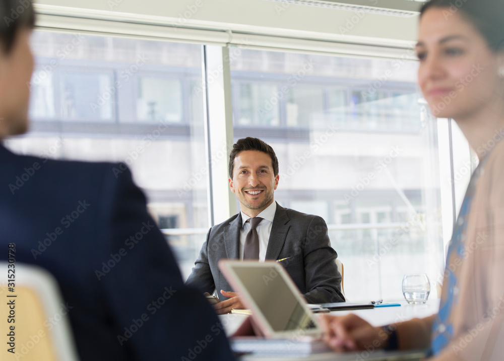 Portrait smiling, confident businessman in conference room meeting Portrait smiling, confident businessman in conference room meeting