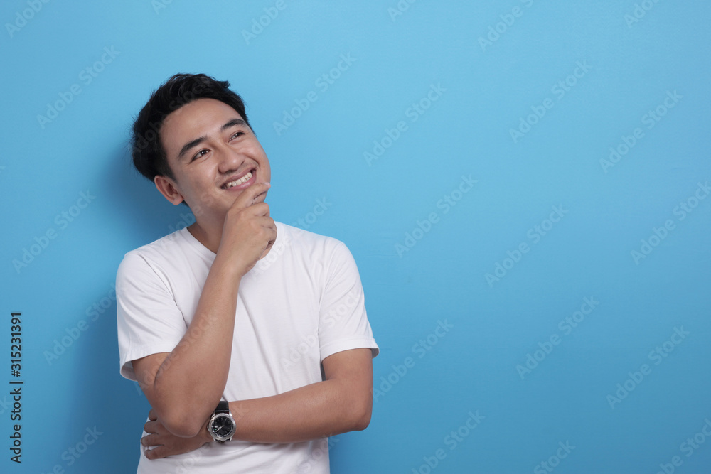 Asian man thinking something, looking for good idea Asian man thinking something, looking for good idea