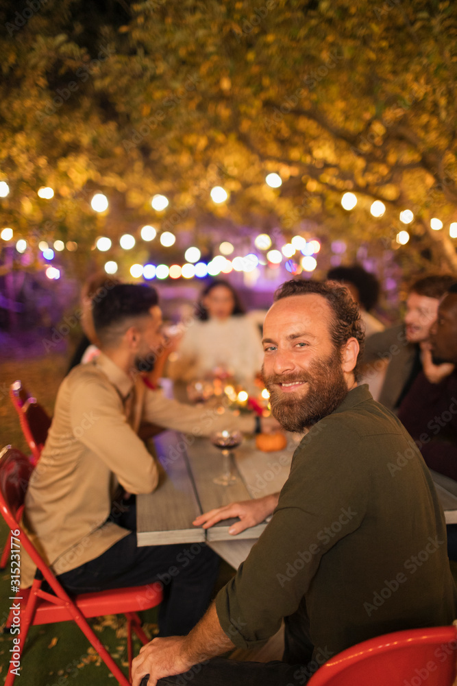 Portrait happy man enjoying dinner garden party Portrait happy man enjoying dinner garden party