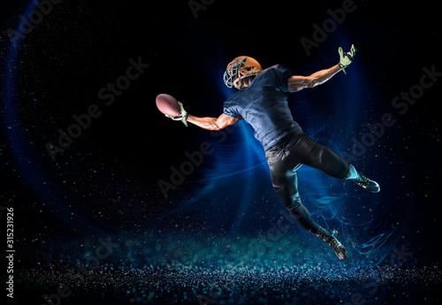 Football player reaching to catch football