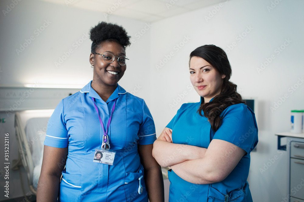 Portrait confident female nurse and doctor in hospital room Portrait confident female nurse and doctor in hospital room