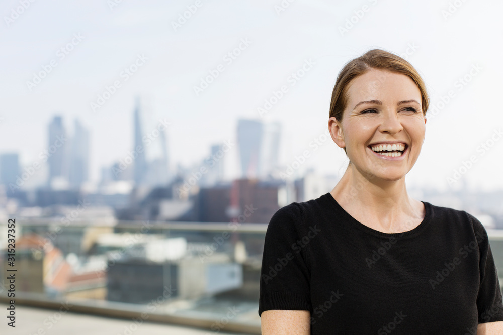 Enthusiastic businesswoman on modern balcony Enthusiastic businesswoman on modern balcony