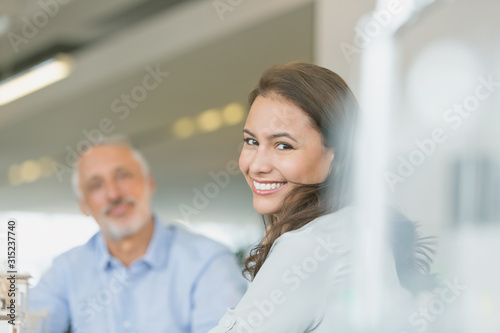 Portrait smiling businesswoman in meeting