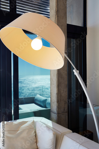 Arc sectional lamp in luxury living room with ocean view