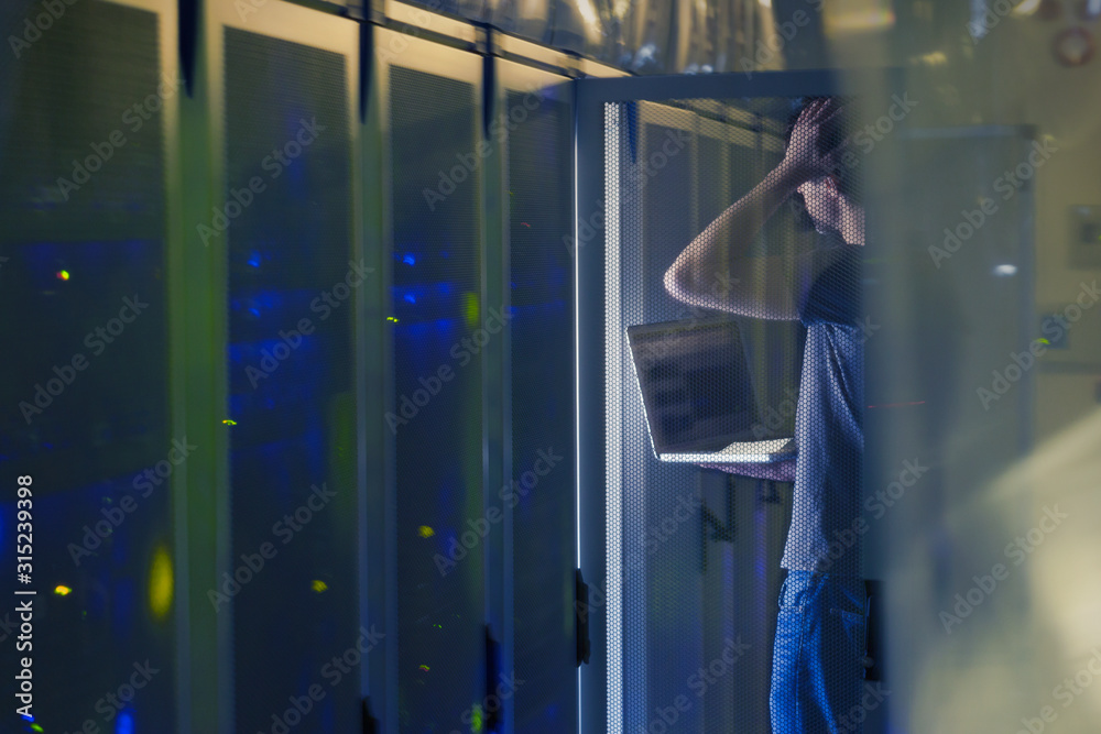 Server room technician with laptop Server room technician with laptop