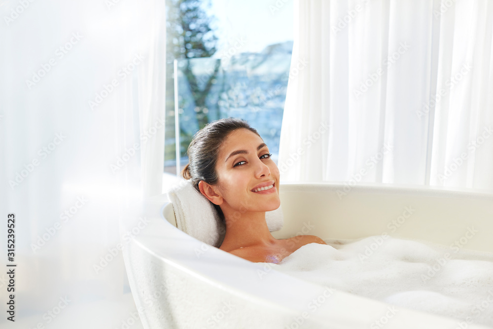 Portrait smiling woman relaxing enjoying bubble bath Portrait smiling woman relaxing enjoying bubble bath