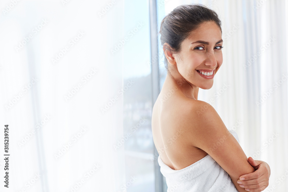Portrait smiling woman wrapped in towel Portrait smiling woman wrapped in towel