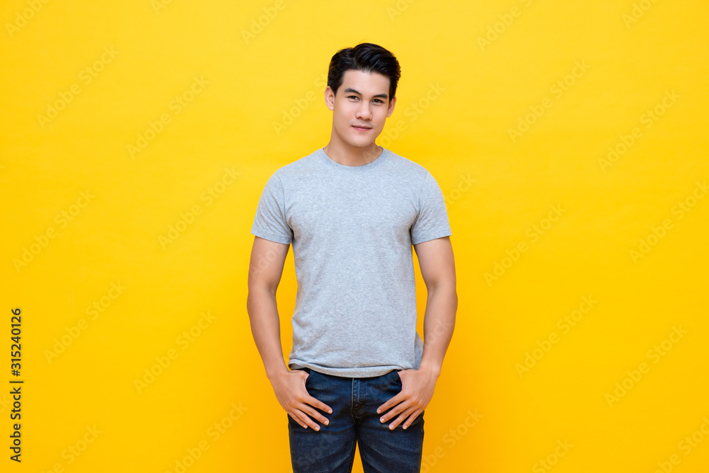 Handsome young Asian man in plain light gray t-shirt Handsome young Asian man in plain light gray t-shirt