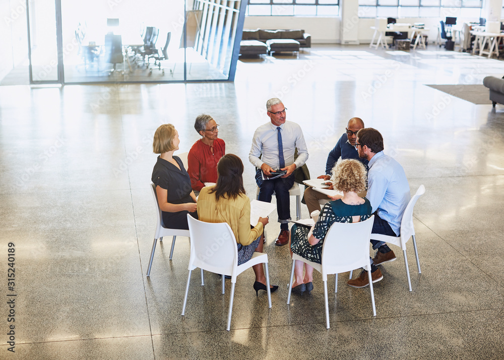 © Ryan Lees/Caia Image - Business people meeting in circle