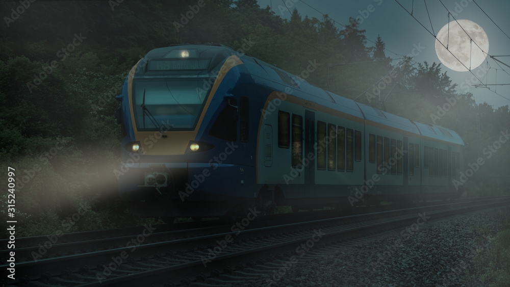 Naklejka premium A German regional train at night with a full moon and fog on the route near Kassel heading east. The headlights shine through the haze on the tracks.