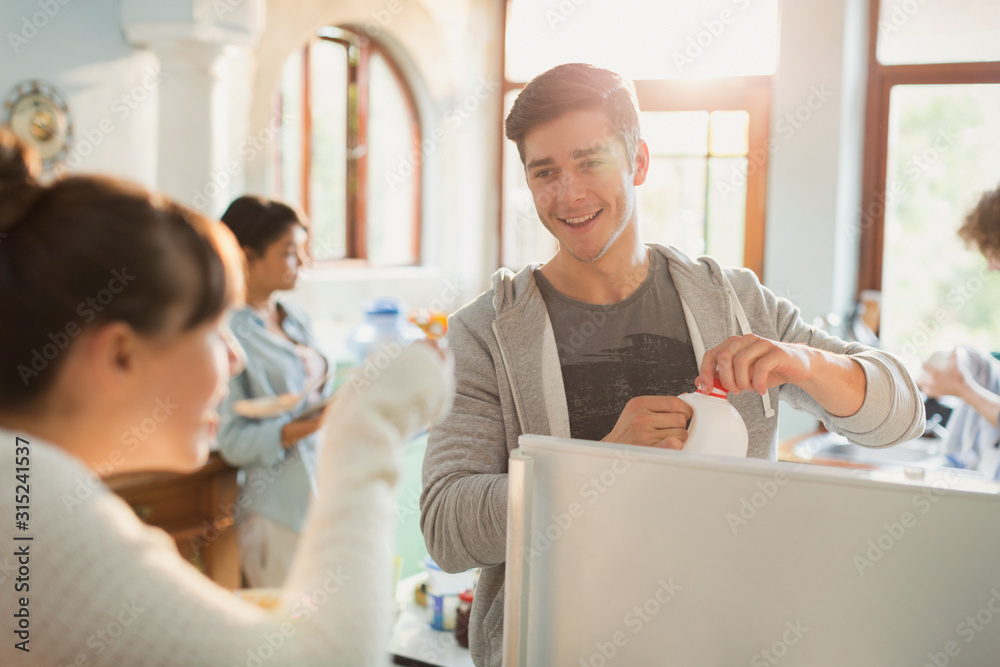 Young adults enjoying breakfast in apartment kitchen Young adults enjoying breakfast in apartment kitchen
