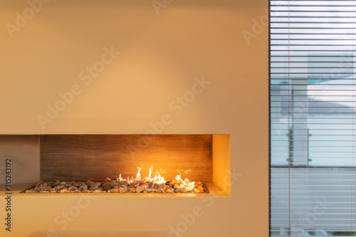 Modern rock gas fireplace in home showcase interior photo