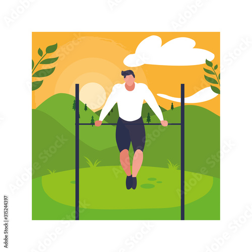 man up hanging on horizontal bar, outdoor or gym sport