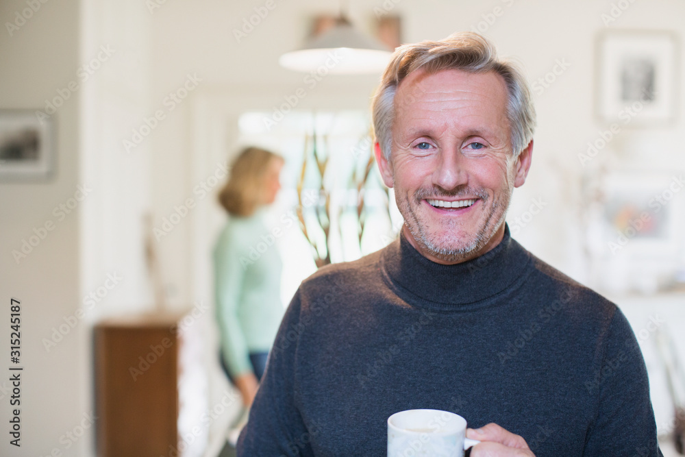 Portrait smiling, confident mature man drinking tea Portrait smiling, confident mature man drinking tea