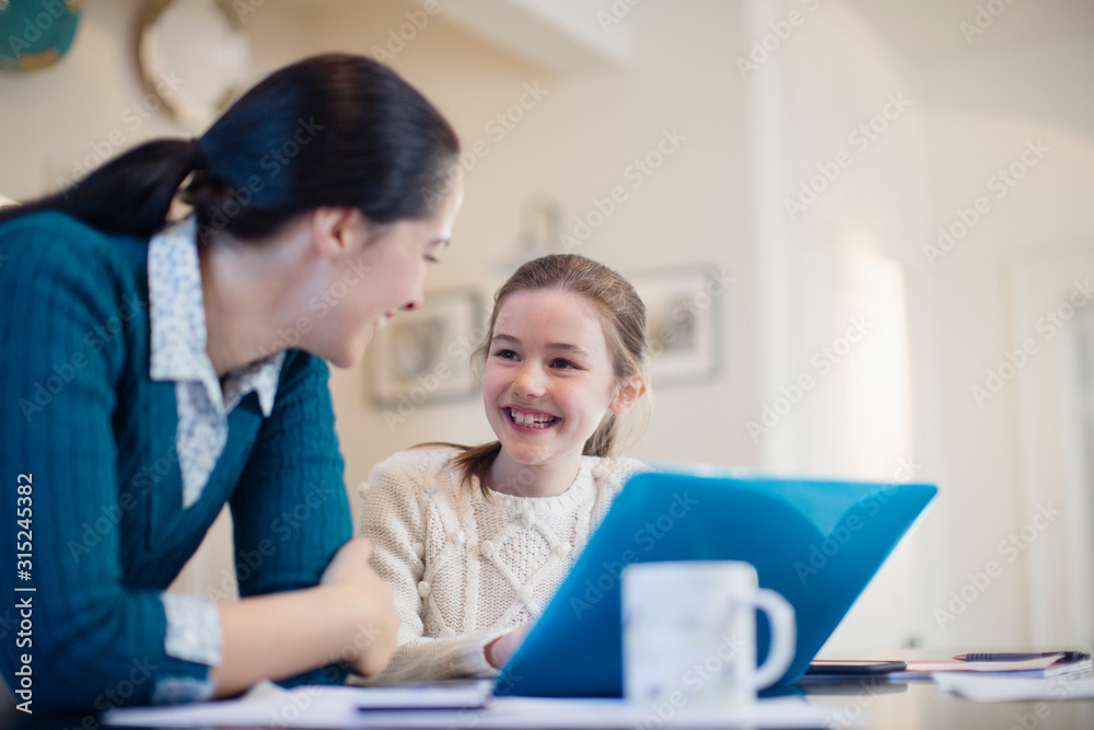 Happy mother and daughter using laptop Happy mother and daughter using laptop