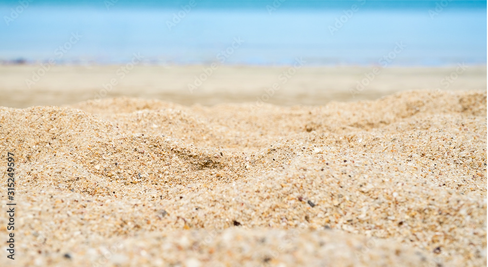 Close up wave of blue sea on sand beach seashore,nature background,summer time Close up wave of blue sea on sand beach seashore,nature background,summer time