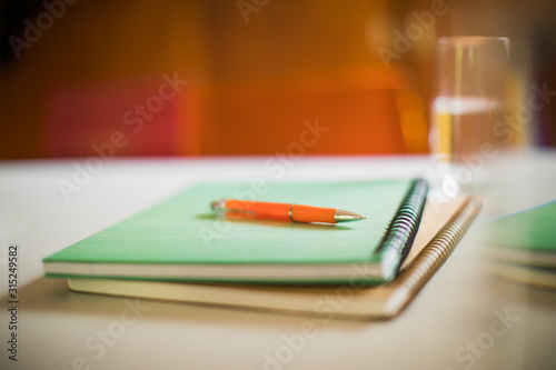 Close up spiral notebooks and pen