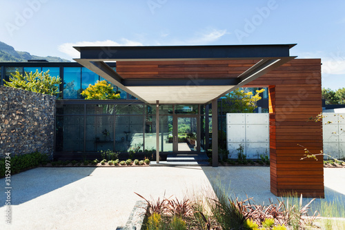 Sunny, modern luxury home showcase exterior photo
