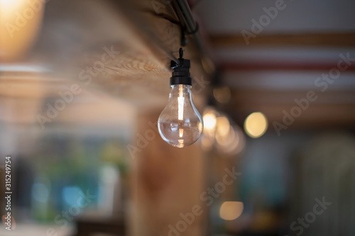 Water filling clear light bulb photo