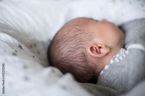 Close up innocent newborn baby boy sleeping