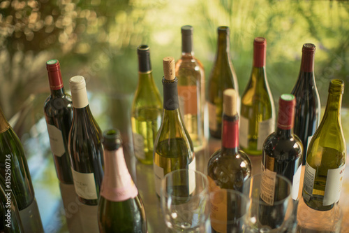 Variety of wine bottles on table photo