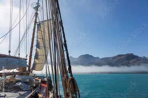 Sailboat on sunny Atlantic Ocean Greenland photo