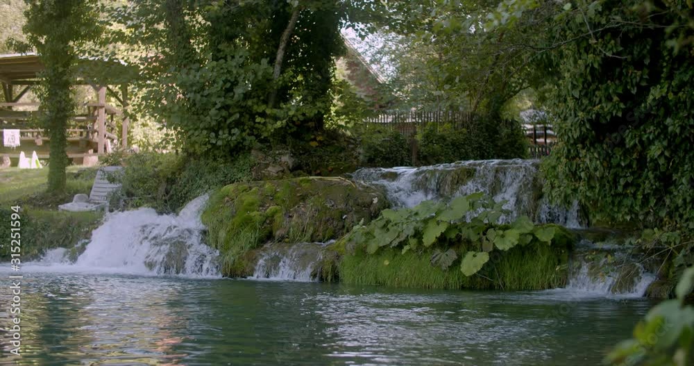 Wide shot of a small backyard water stream in croatia Wide shot of a small backyard water stream in croatia