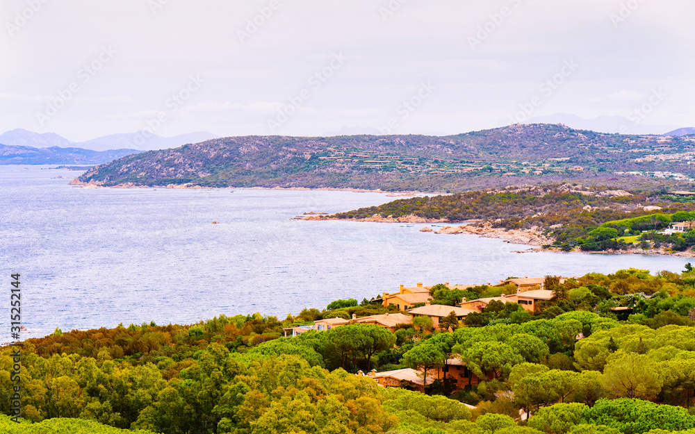 Landscape of Capo Coda Cavallo seen from San Teodoro in the Mediterranean sea in Olbia-Tempio province, Sardinia island, Italy in summer. Scenery at Tavolara Island. Mixed media.