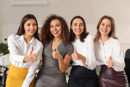 Young women showing thumb-u...