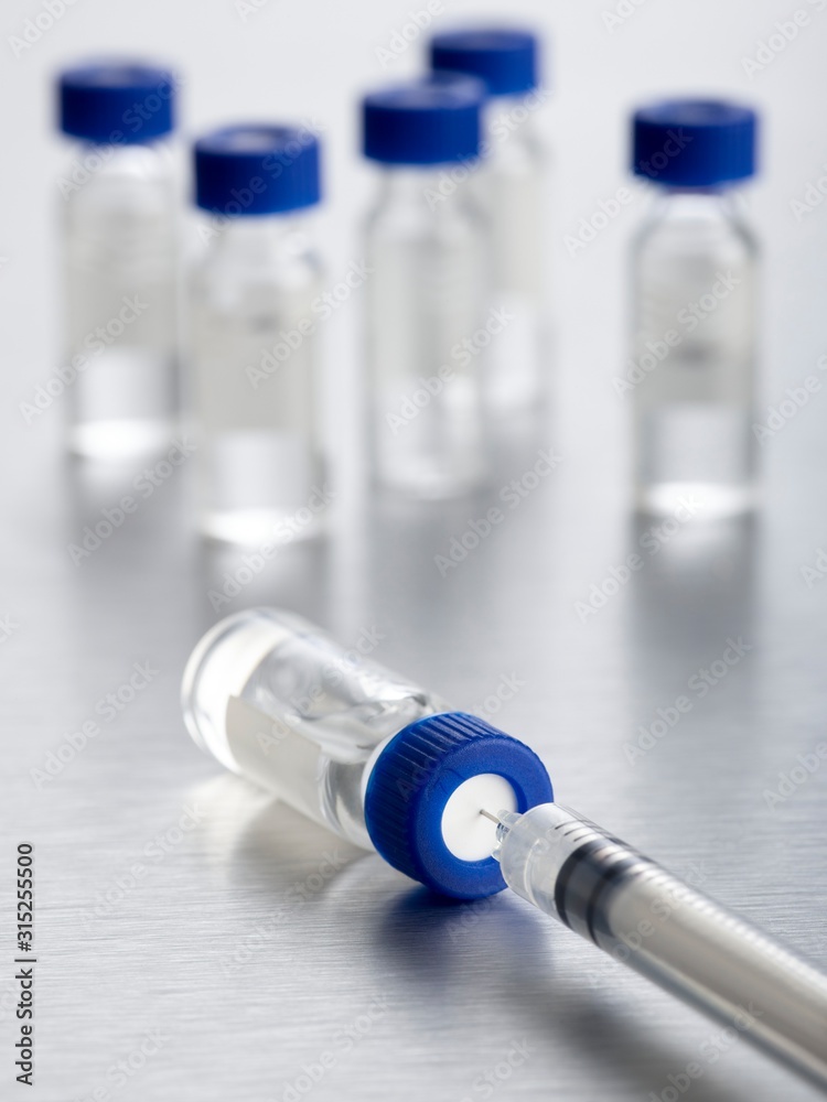 Vaccine vials and syringe Vaccine vials and syringe